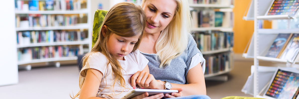 Mom and child looking at ipad